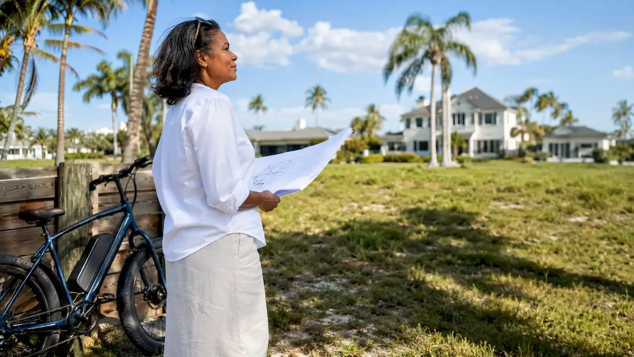 Affluent buyer inspecting Tampa vacant lot